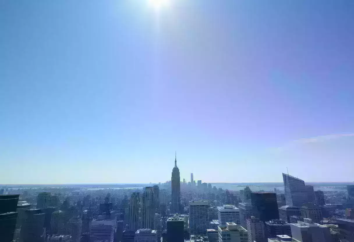 A city skyline under a scorching sun during a heat wave