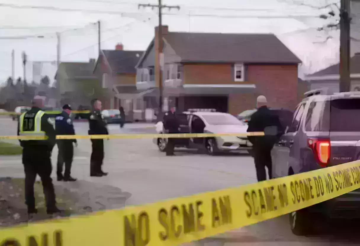 Police officers investigating a crime scene with tape surrounding a vehicle