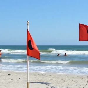 Charleston beach with lifeguards and warning signs for rip currents
