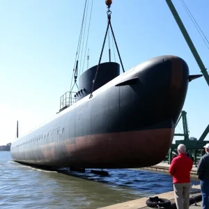 Recovery of the H.L. Hunley submarine by a crane in Charleston