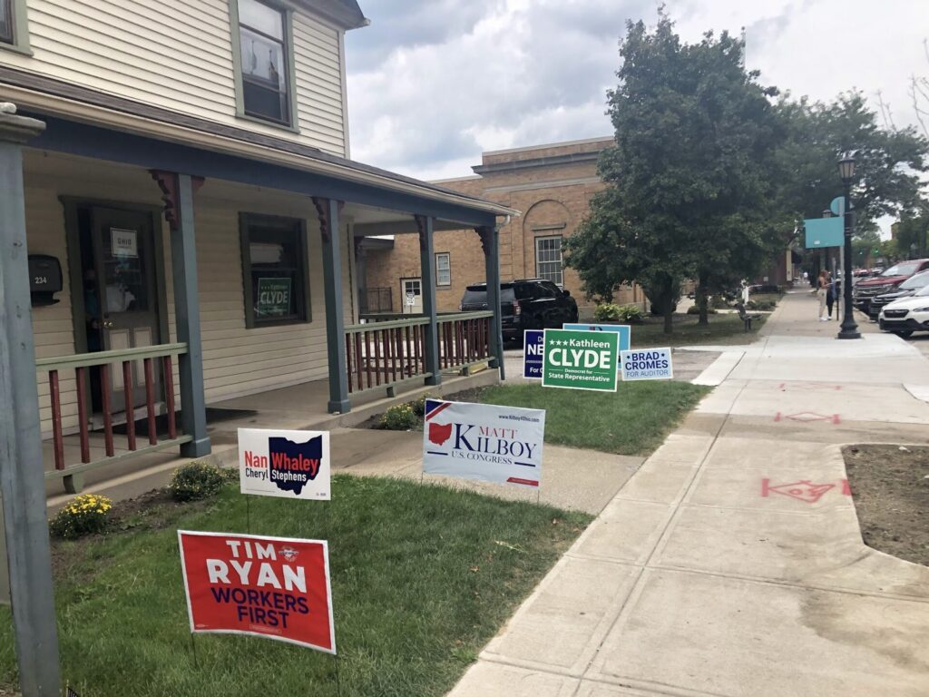 Campaign yard signs outside a polling place