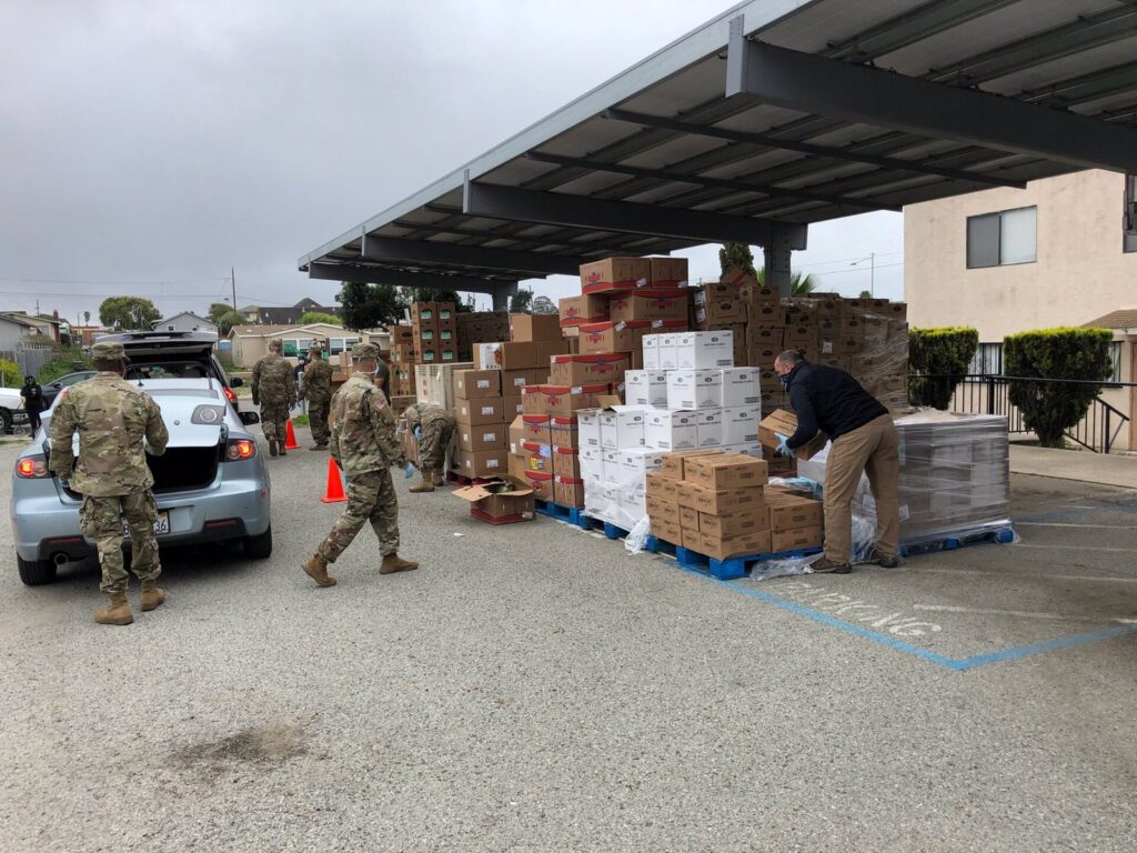 Volunteers loading food donations